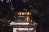 BAMBUM First Edition box on a marble pedestal
